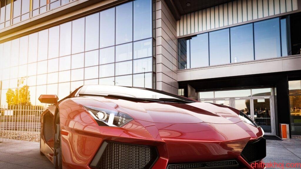 red-sports-car-near-building-wallpaper